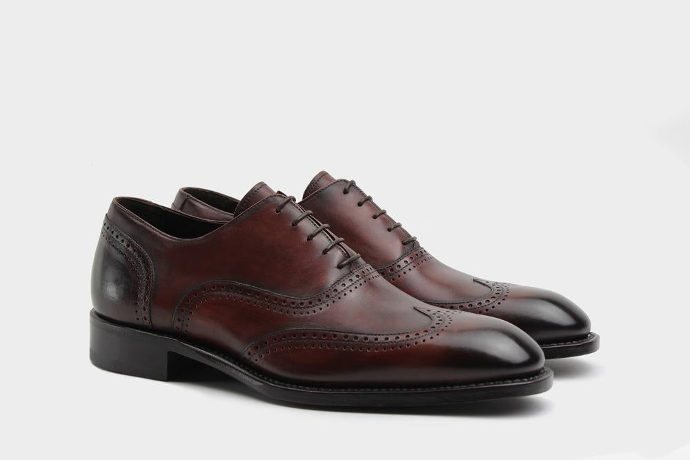 Grey full brogue wingtip dress shoe with perforated detailing