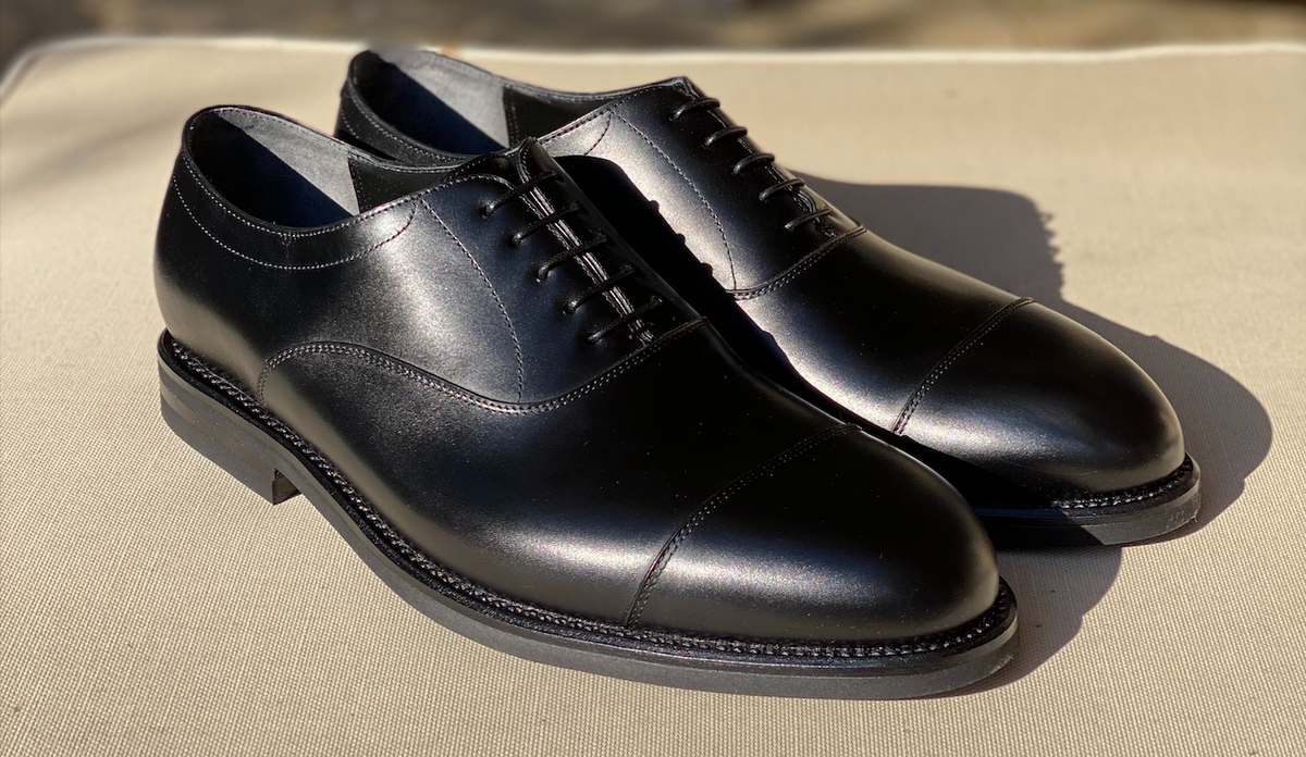 Black cap-toe Oxford dress shoes