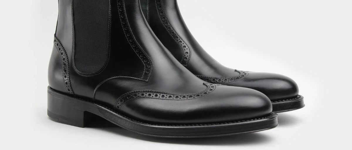 Wingtip boot and Chelsea boot showing laces and elastic closures
